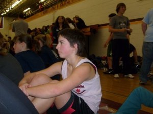 Me with short hair at a wrestling tournament